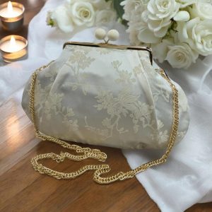 Borsa clutch in tessuto jaquard con fiori beige