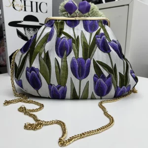 Borsa clutch in tessuto jaquard con tulipani viola