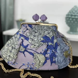 Borsa clutch in tessuto jacquard con fiori