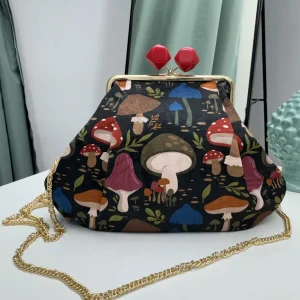 Borsa clutch in tessuto jacquard in fantasia funghi